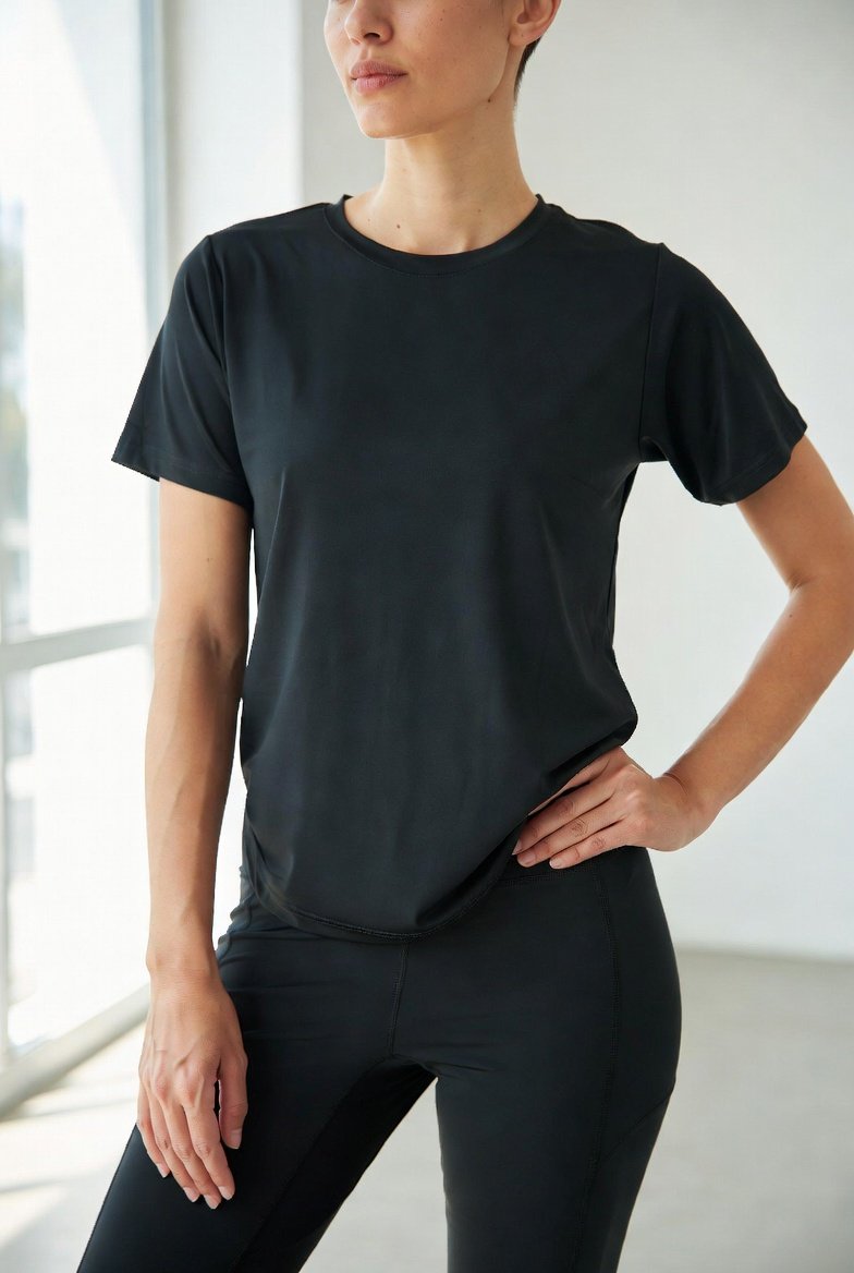 Model wearing a plain dri-fit tee and leggings from the activewear range