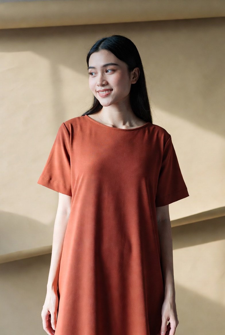 Model wearing a plain day dress from the dresses and skirts range